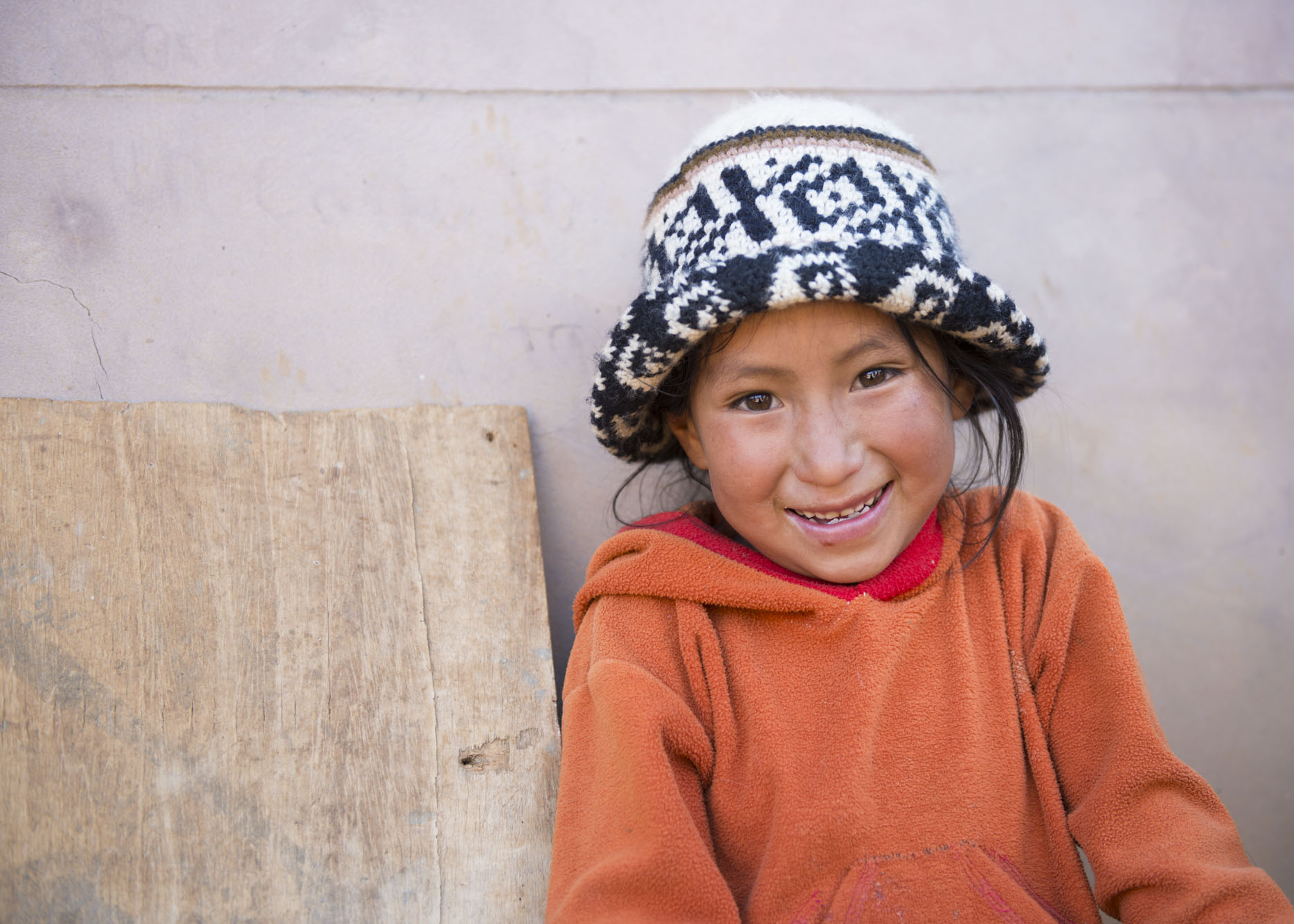 Quechua girl smiles at the camera